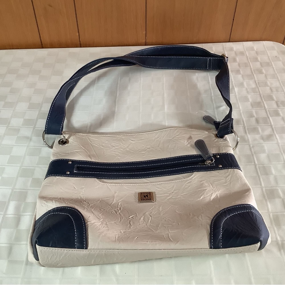 New cream & navy blue purse by Stone co